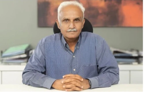 Ashit Vora, 64, an electrical contractor who introduces himself as his company's Chief AI Officer rather than its CEO